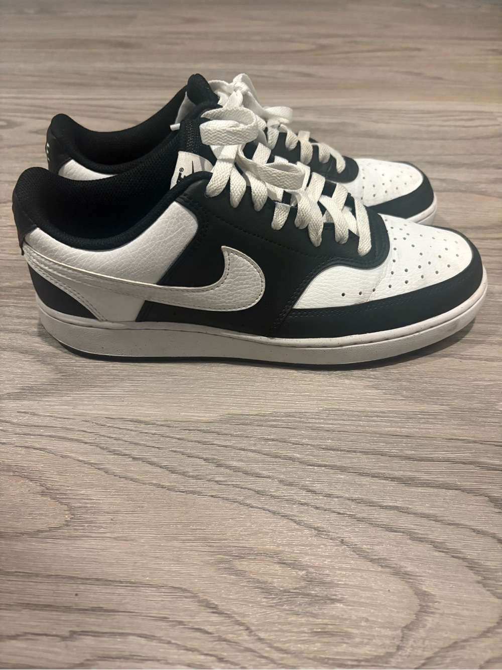 Nike Women’s Black and White Low-Top Sneakers with White Swoosh